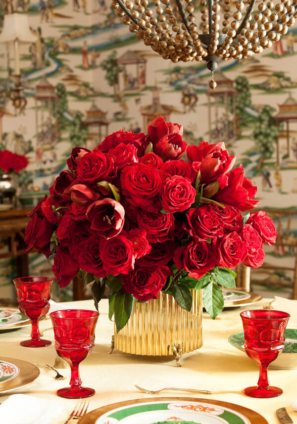 christmas centerpiece of red roses amaryllis tulips